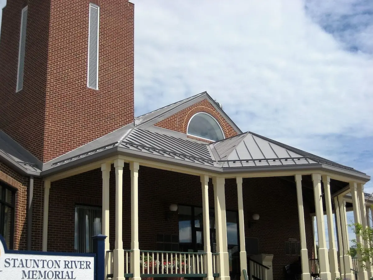 Skilled roofing craftsmen working on a residential roof in Zanesville